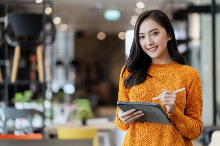 Smart Confidence Asian Female Startup Entrepreneur Small Business Owner Businesswoman Wear Smart Casual Cloth Smile Hand Use Tablet Woking Inventory Checking Showroom Office Daytime Background